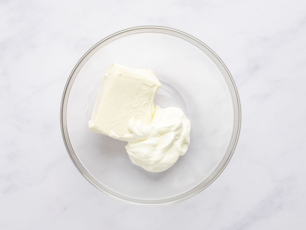 sour cream, cream cheese, and salt in small glass bowl