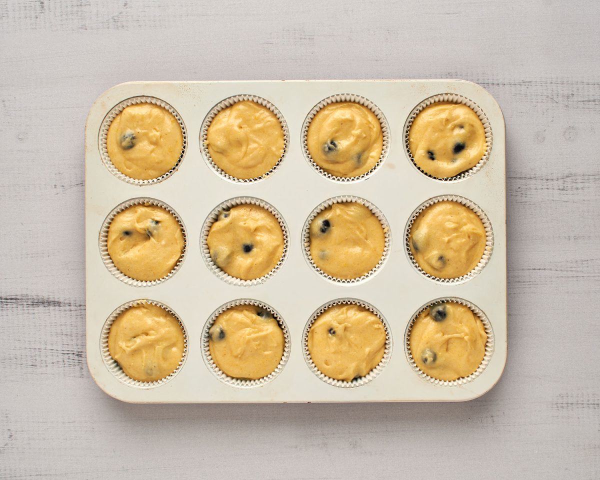 batter divided into muffin pan