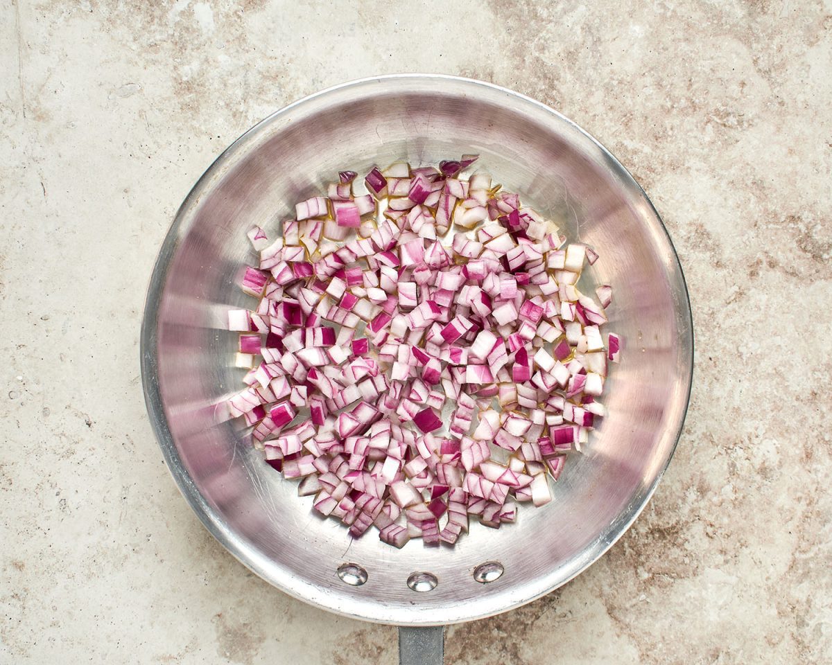 cooking diced red onion in large sauté pan