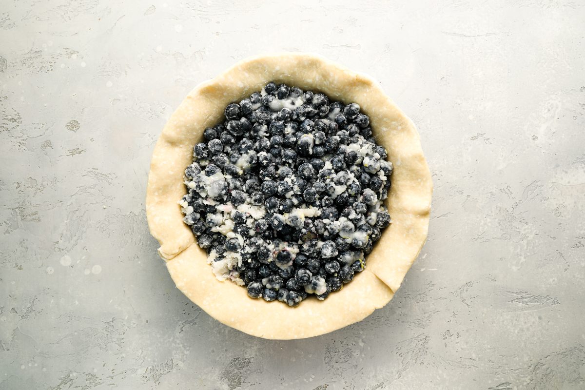 blueberry filling pressed into even layer in pie crust