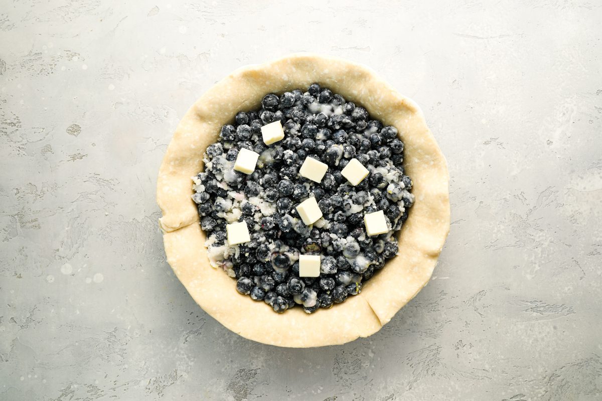 blueberry pie filling dotted with butter cubes