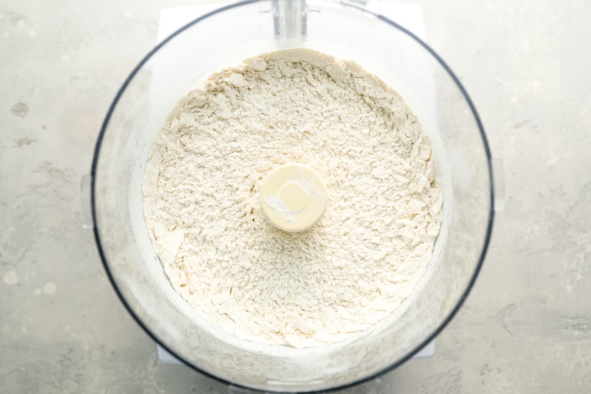 flour, sugar, salt, and baking powder in bowl of food processor fitted with metal blade