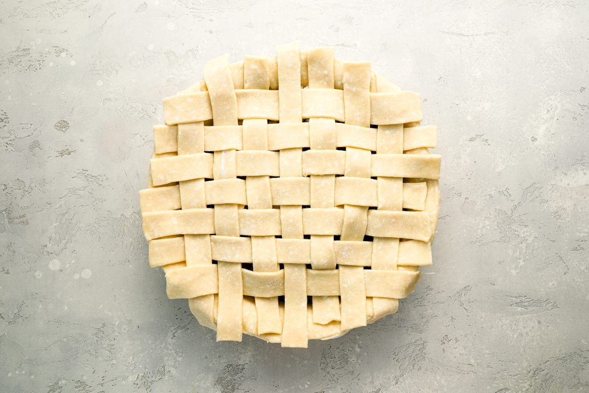 top of pie fully covered with lattice dough strips