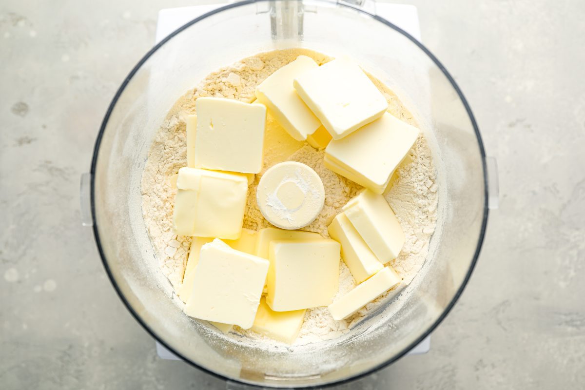 butter added to flour mixture in food processor bowl 