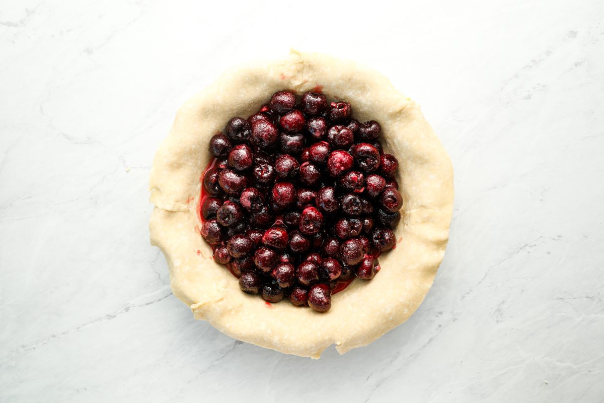 cherry filling in even layer in pie crust