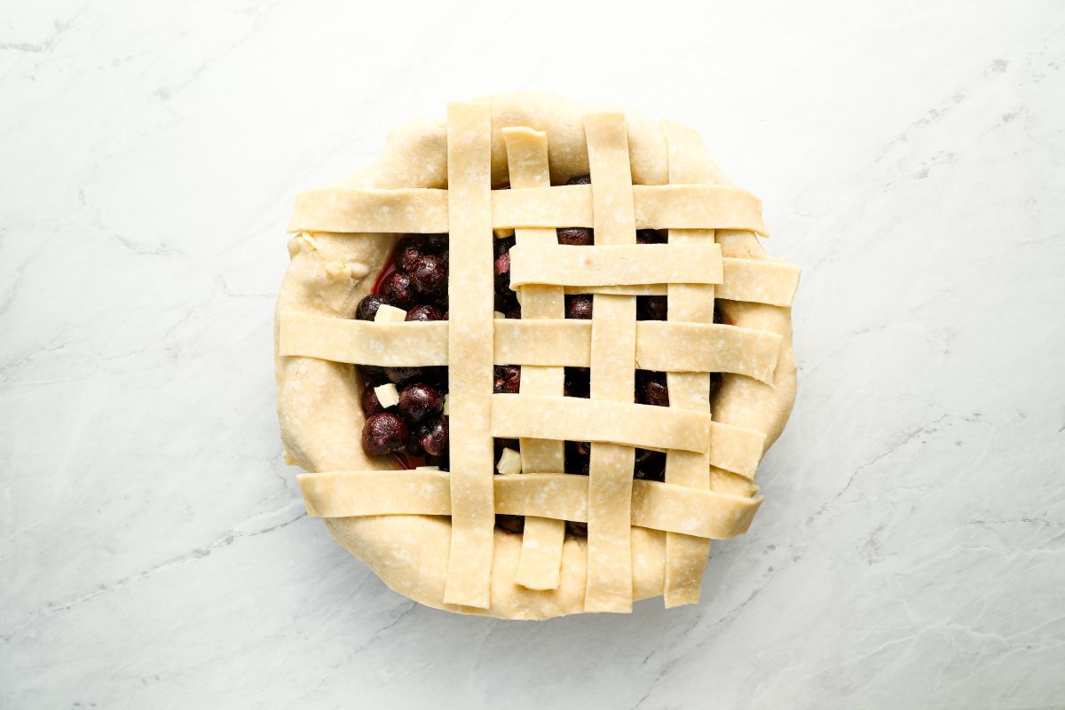 3 vertical strips on top of horizontal strips on cherry pie