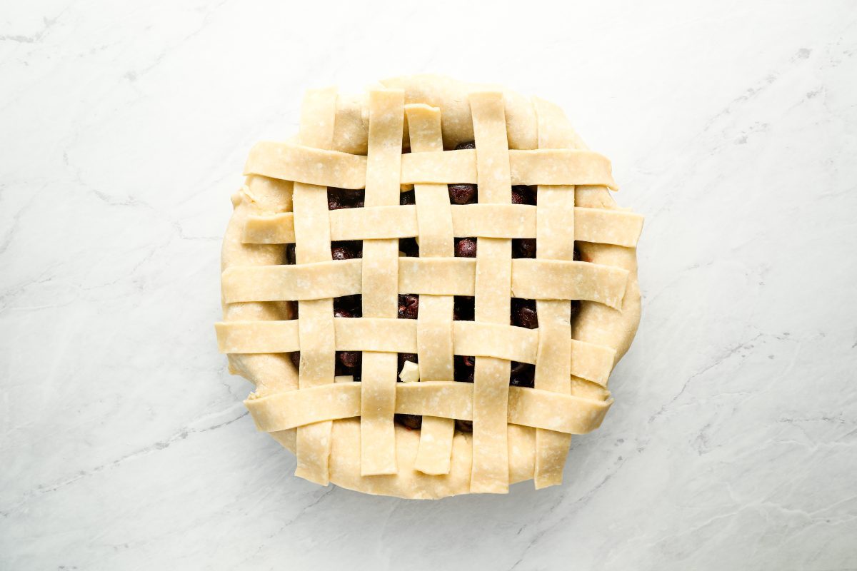 top of pie fully covered with lattice dough strips