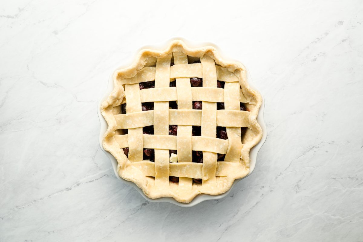 assembled cherry pie with crimped edges