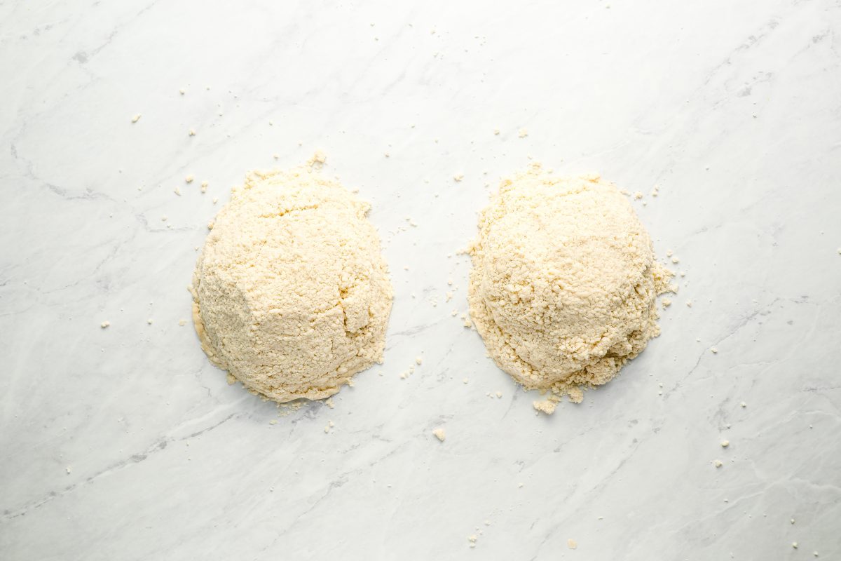 dough crumbles in two piles on work surface