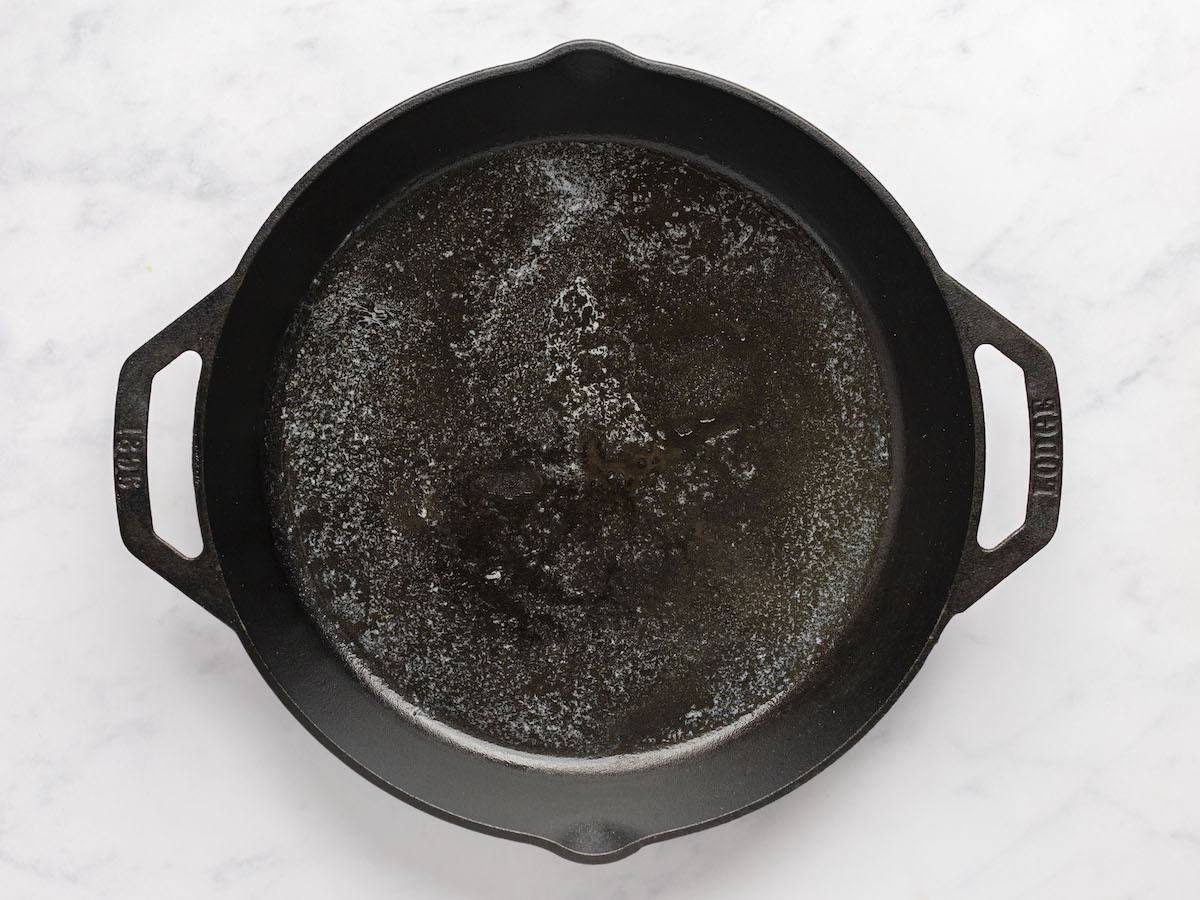 large skillet with melted butter