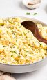 bowl of potato salad with wooden spoon