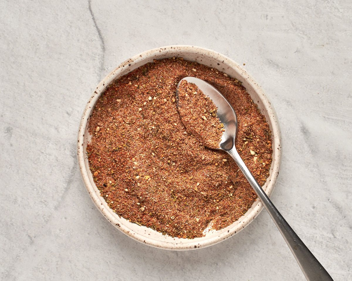 mixed blackened chicken spices in bowl with small spoon