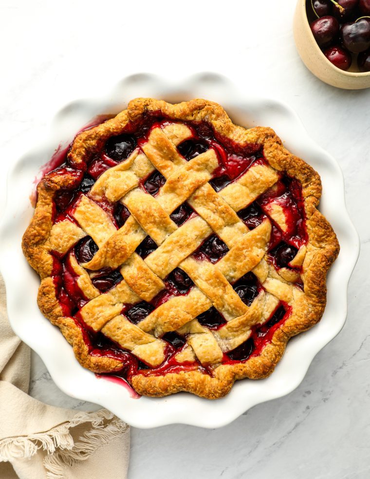 cherry pie with a bowl of cherries