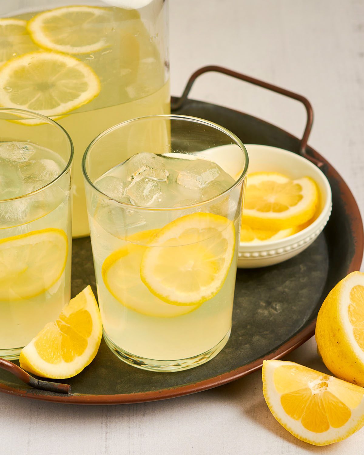 glasses and pitcher of homemade lemonade on tray