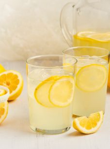 glasses of homemade lemonade with a pitcher