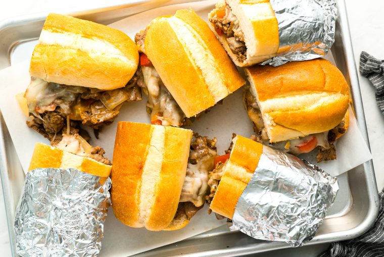 philly cheesesteak sandwiches on sheet pan