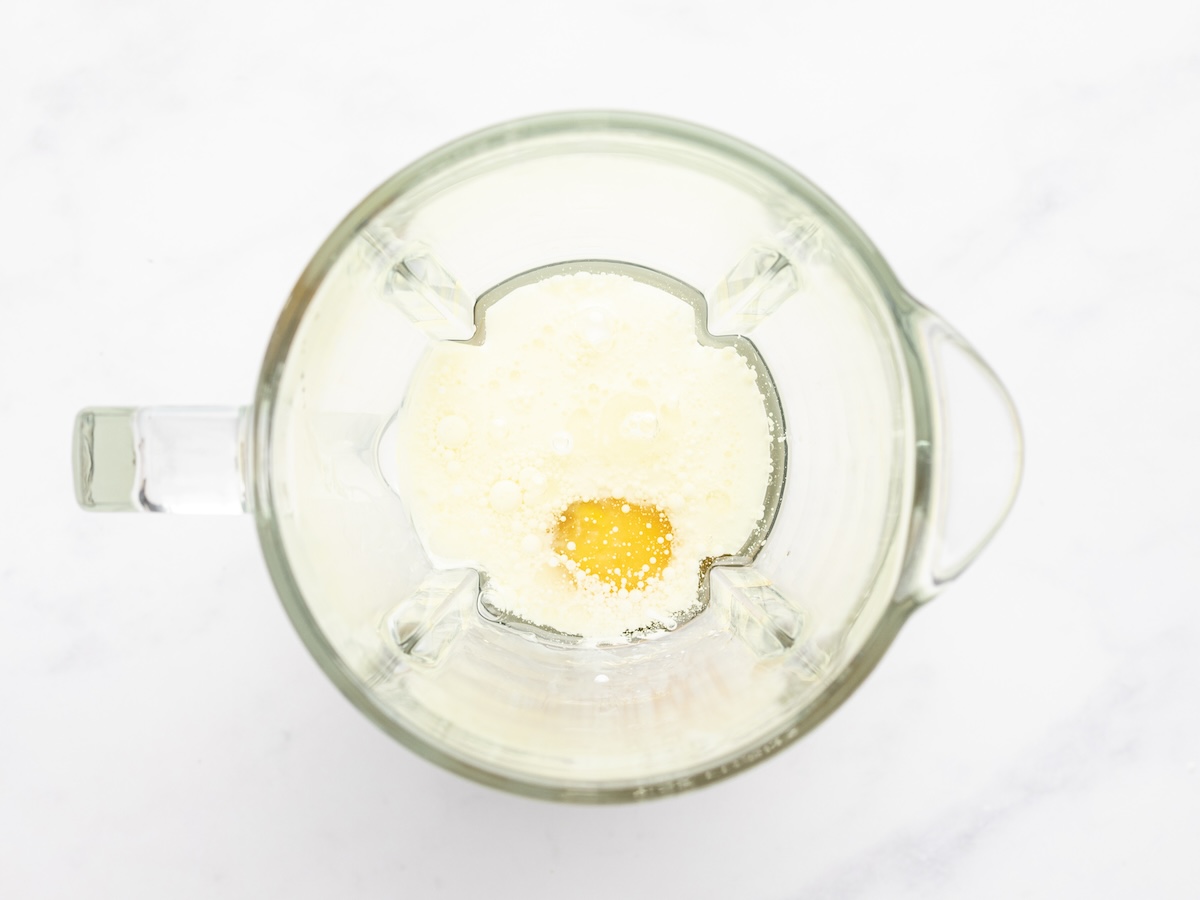 eggs, oil, and milk in blender pitcher