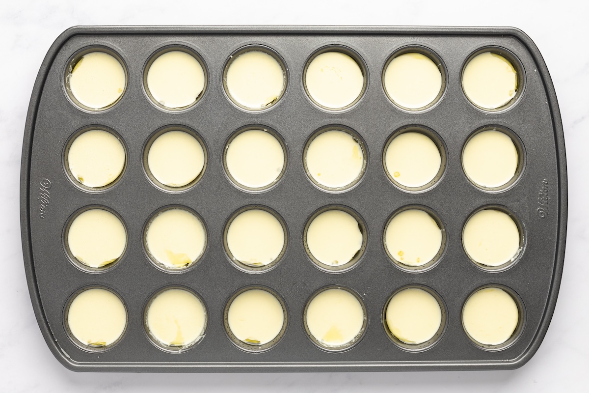 cheese bread batter in muffin tin