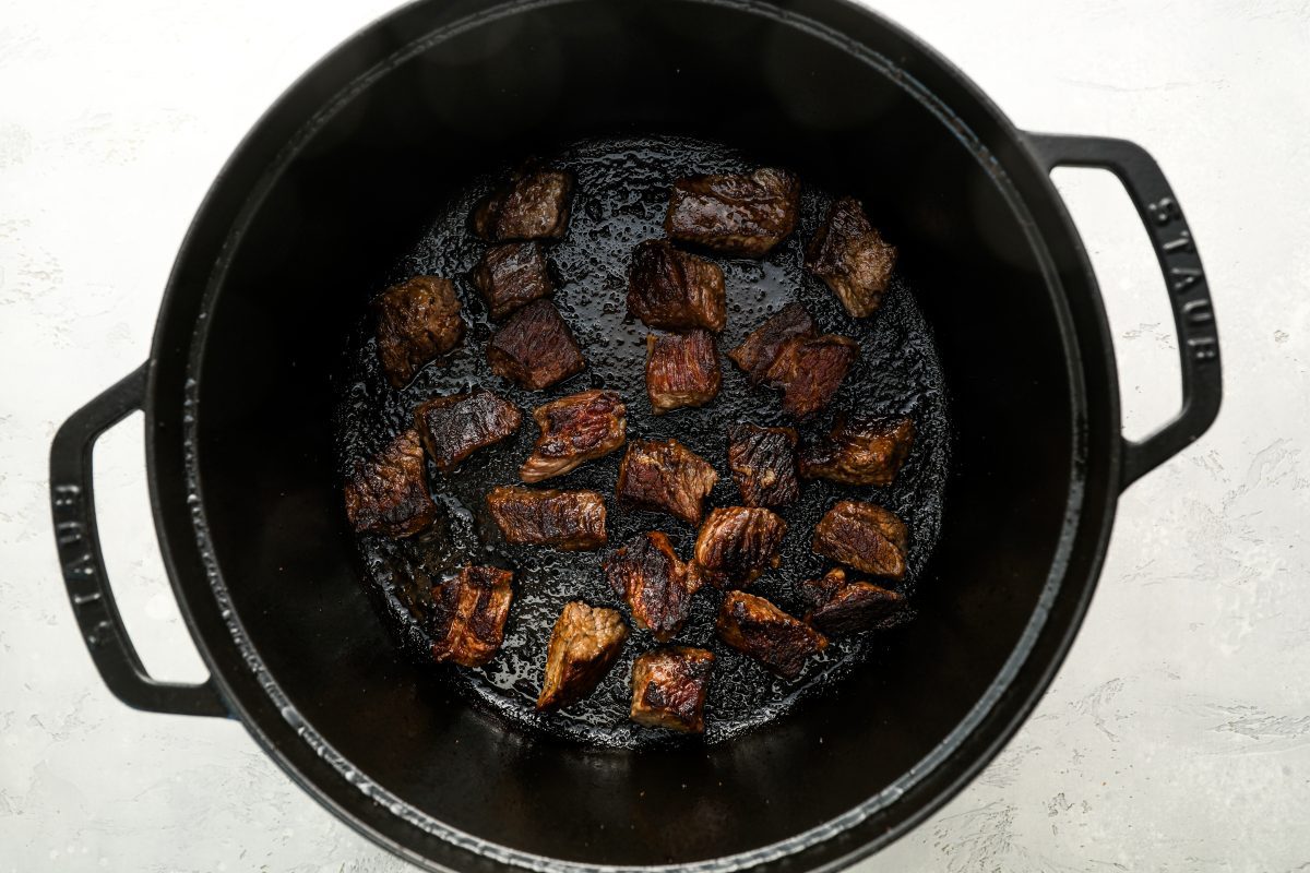 browned beef chuck in large dutch oven