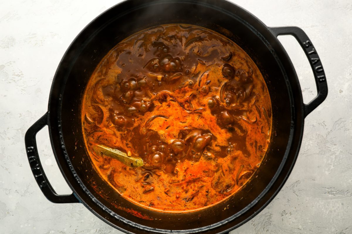 Dutch oven with stew contents after 2 hours of simmering