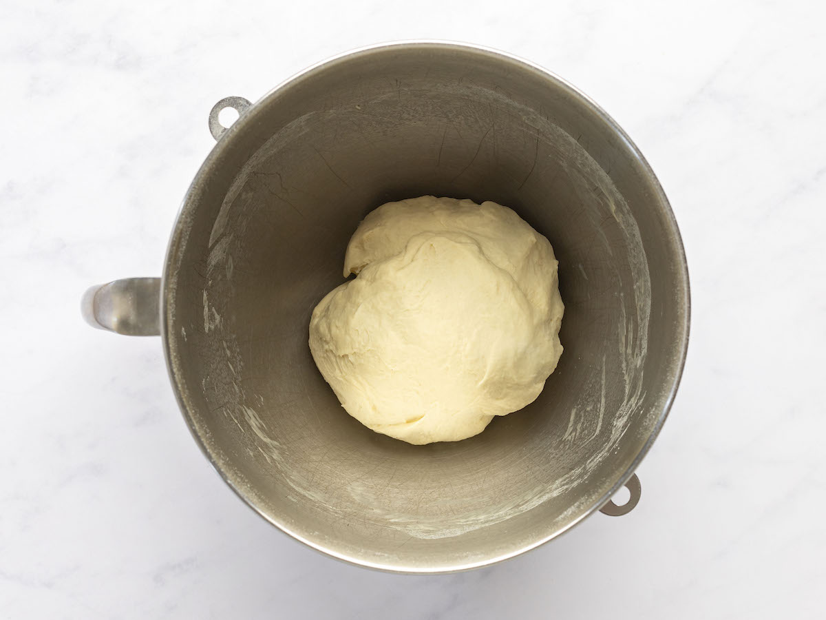 dough formed into ball in mixing bowl