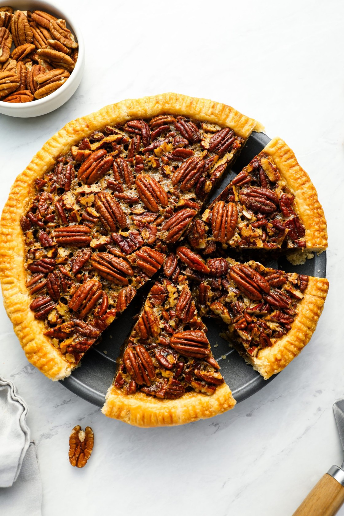 pecan pie sliced in pie dish