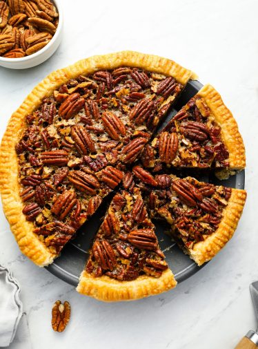 pecan pie sliced in pie dish