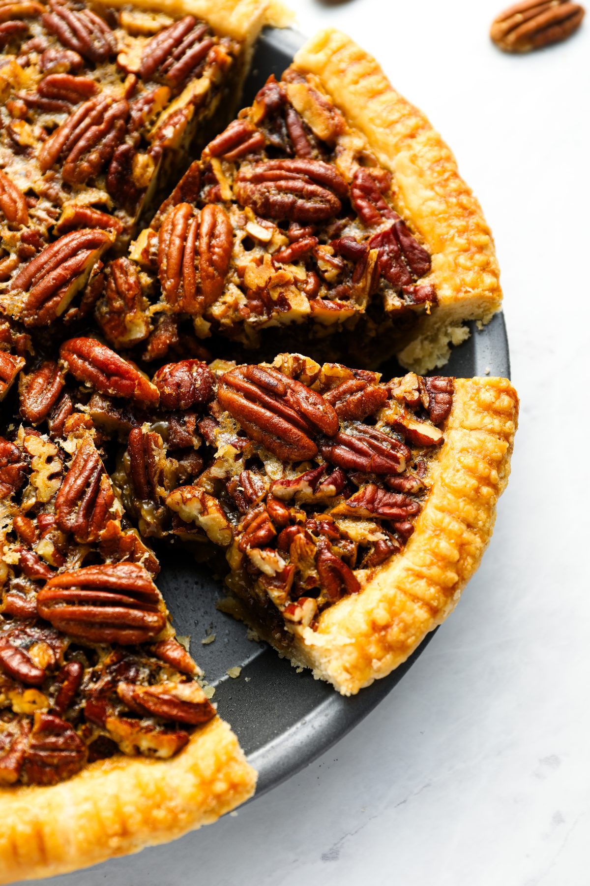 pecan pie sliced in pie pan