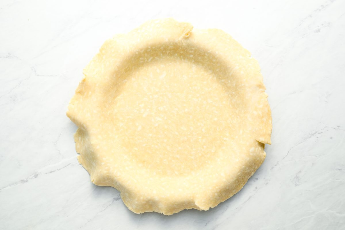 pie dough gently pressed into pie pan