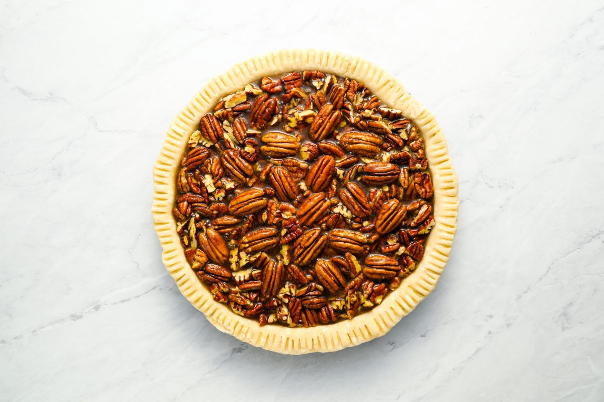 pie crust filled with pecans and egg mixture