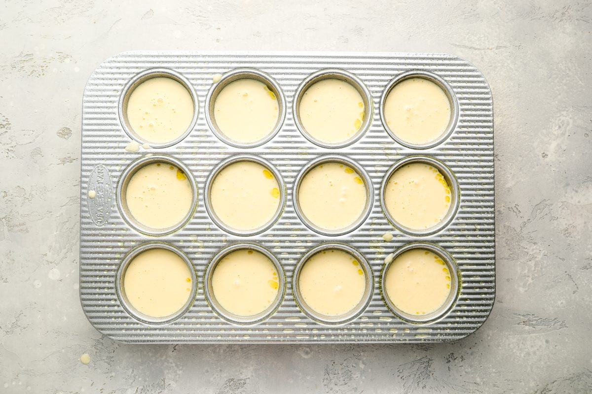 muffin tin filled with popover batter