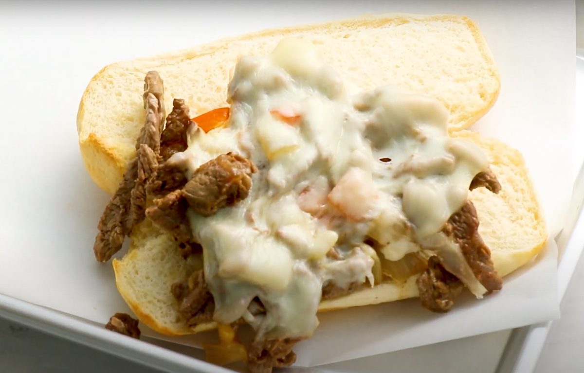 assembling Philly cheesesteak sandwiches