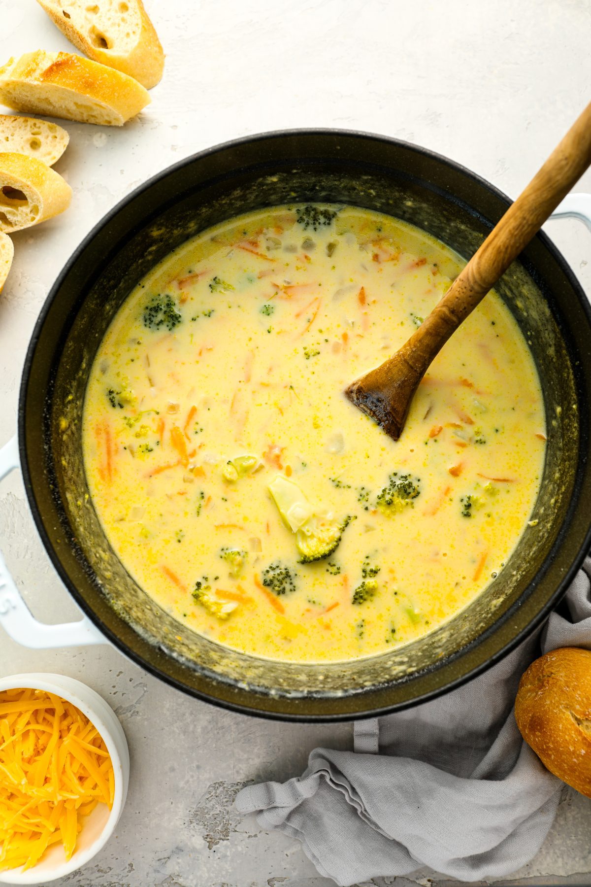 broccoli cheddar soup in Dutch oven with bread