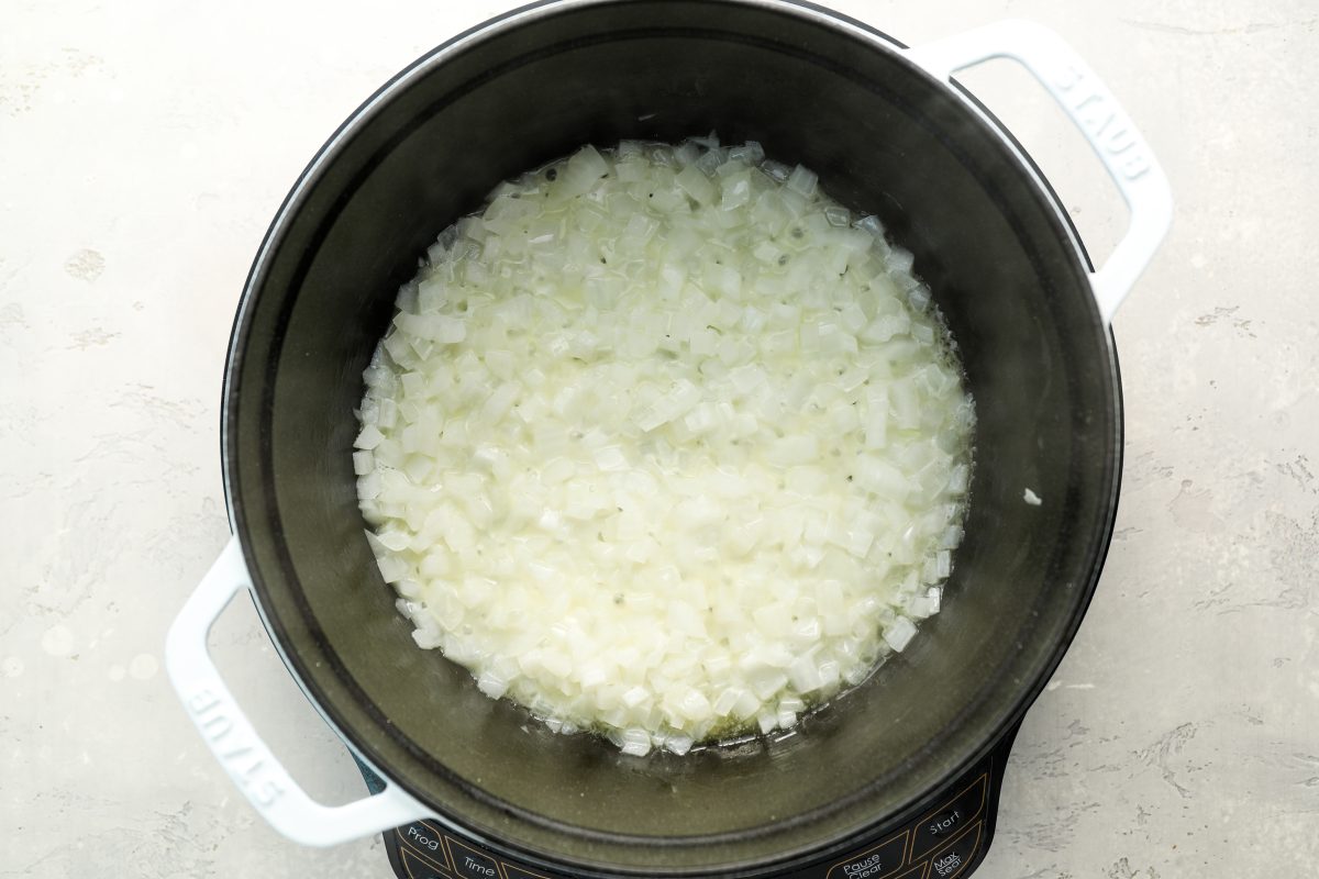 onions cooking in butter in Dutch oven