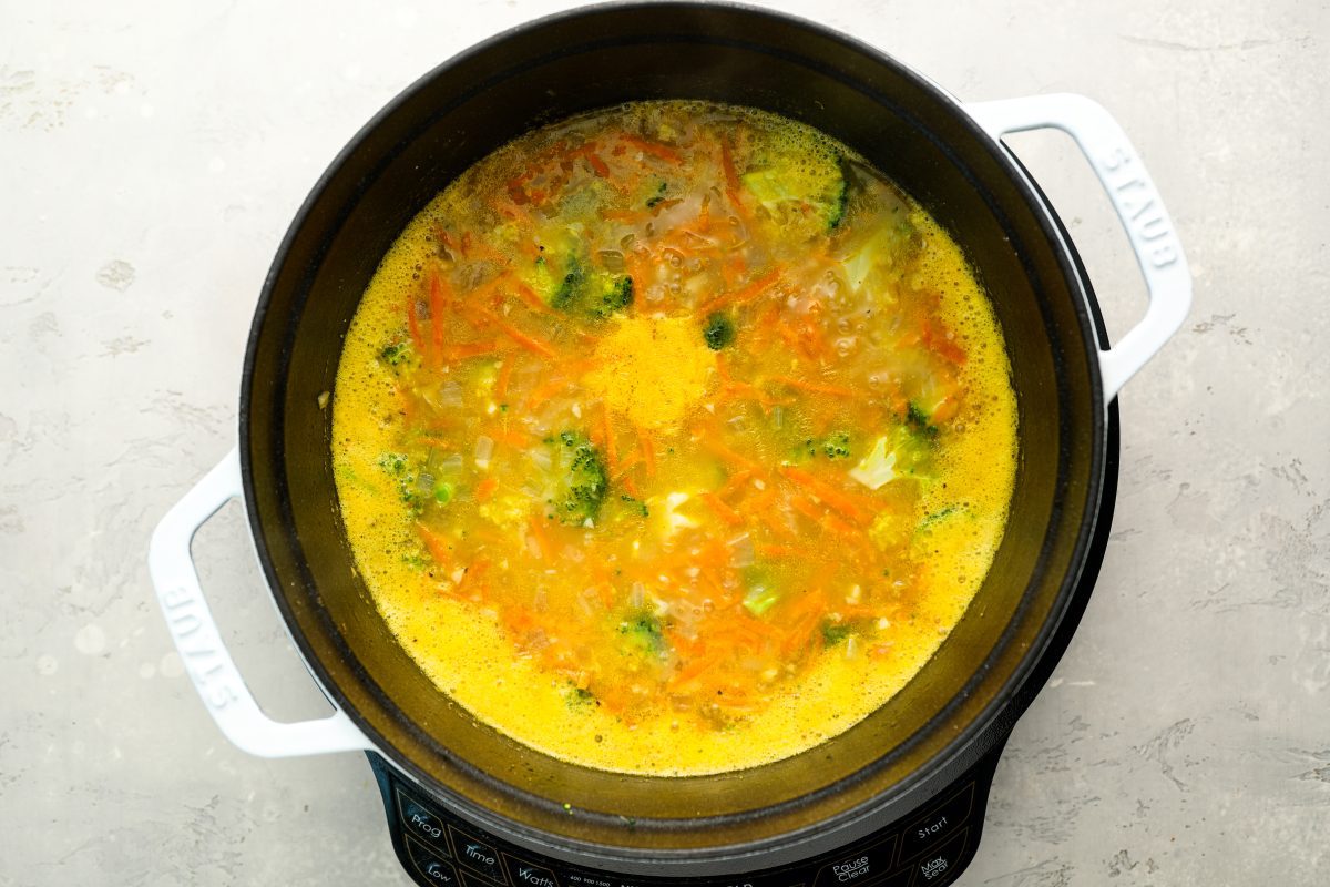 Broccoli florets, salt, pepper, and nutmeg added to broth.