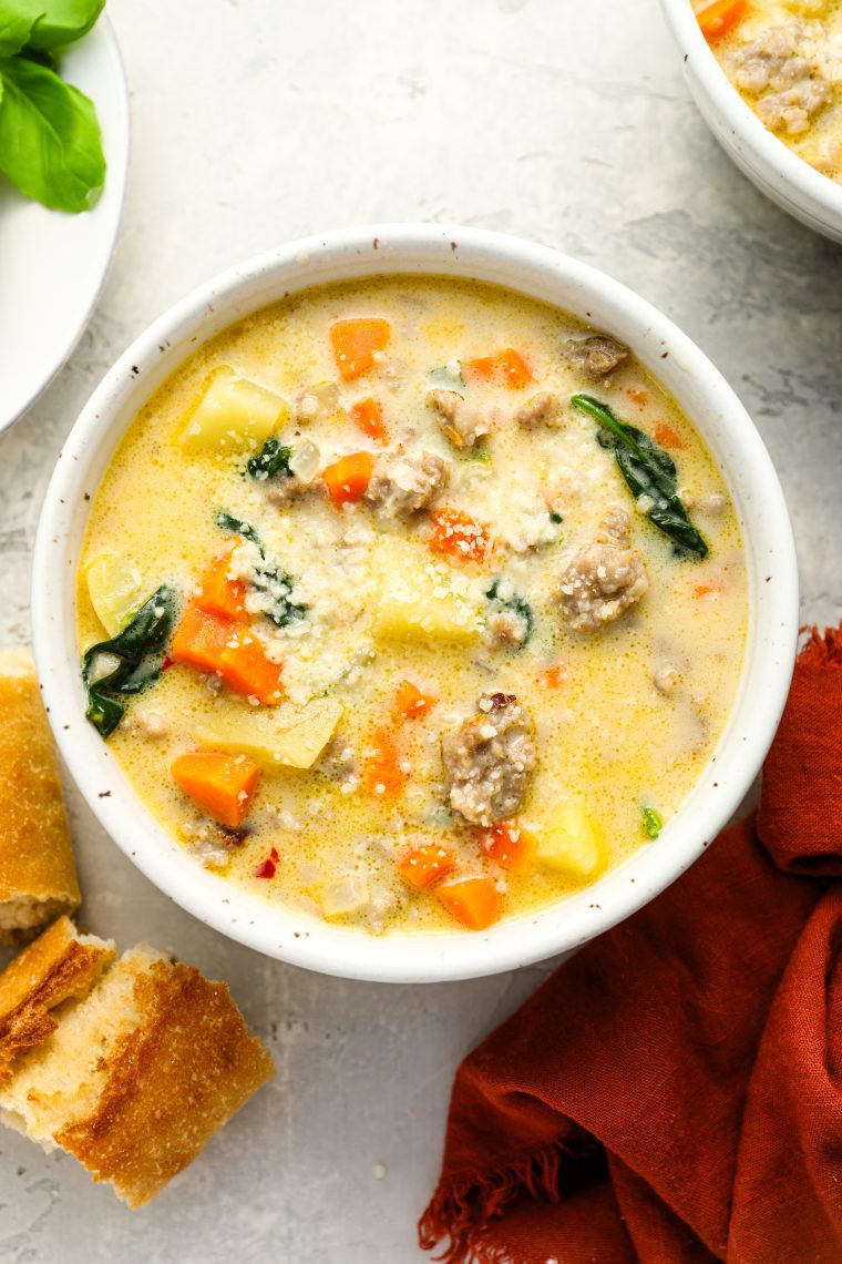 bowl of zuppa toscana with bread