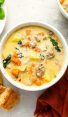 bowl of zuppa toscana with bread