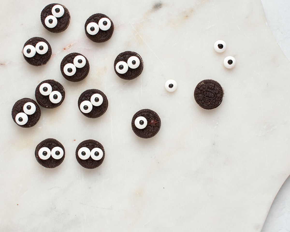 making the bat faces with mini Oreos and googly eyes