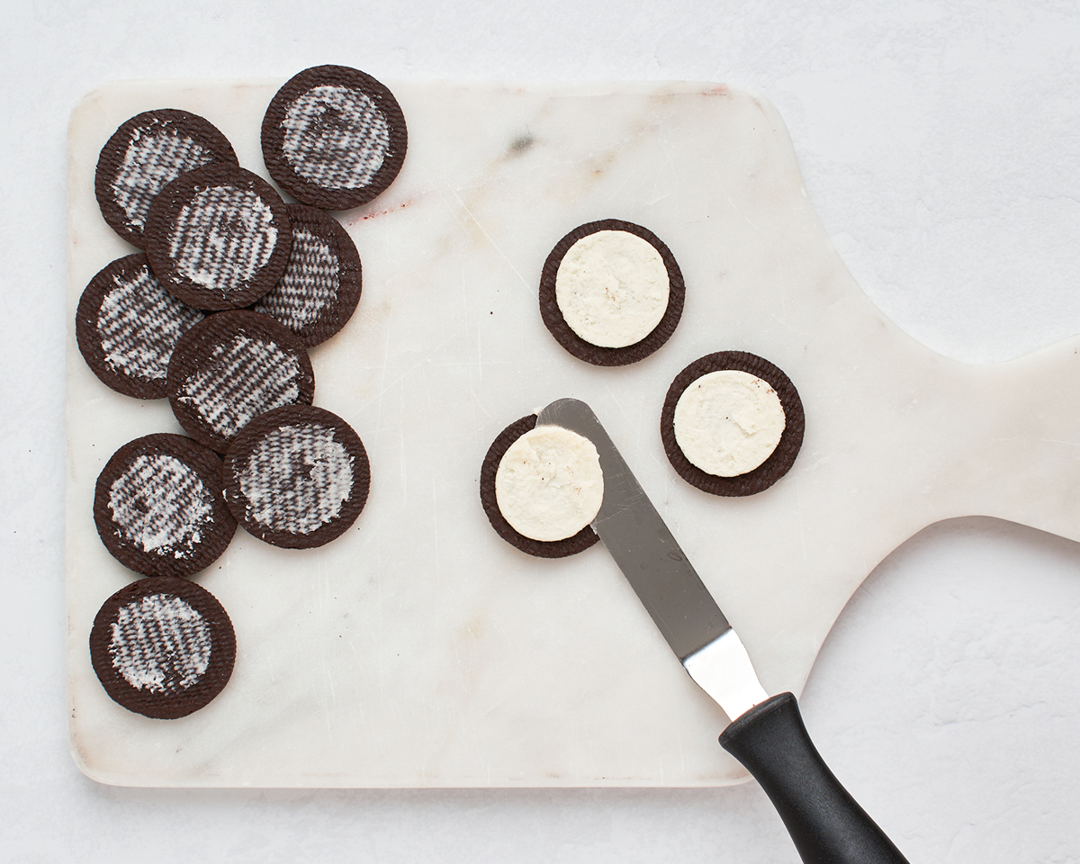 scraping filling from Oreo cookies