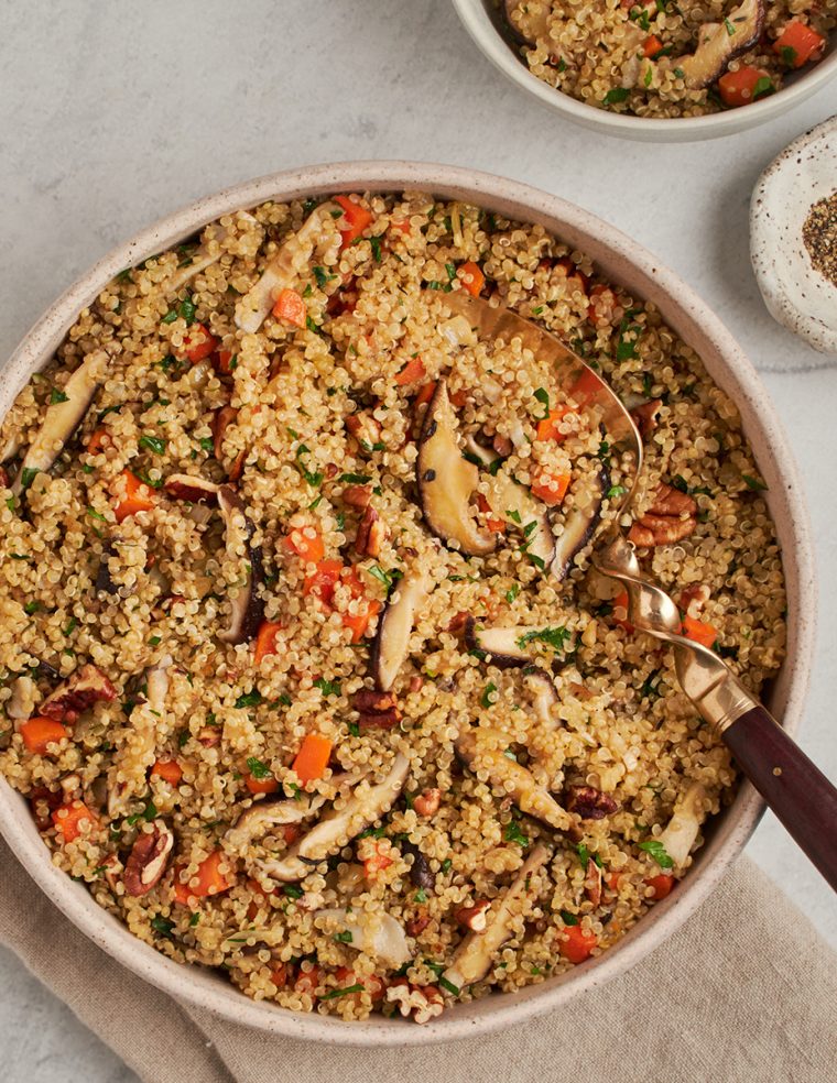 quinoa pilaf with carrots and shiitake mushrooms in bowl