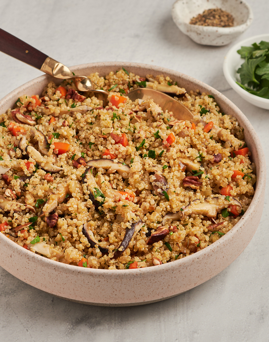 quinoa pilaf with carrots and shiitake mushrooms in bowl