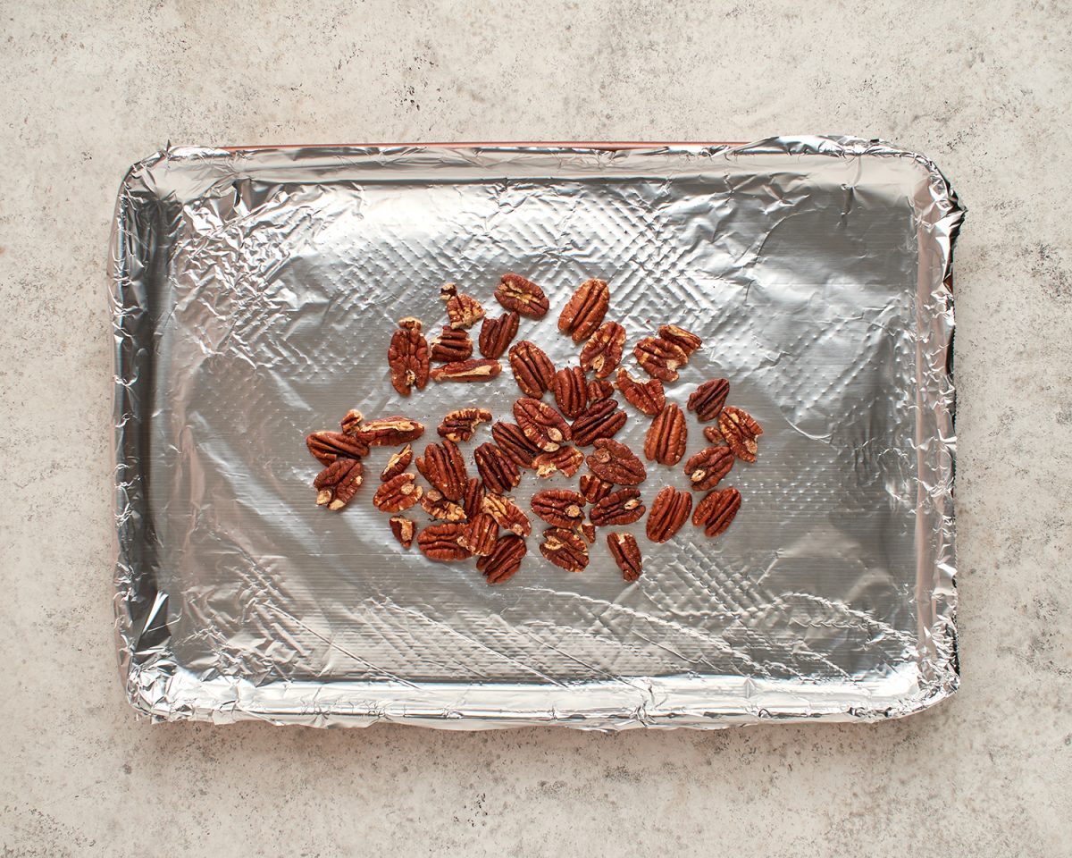 pecans on foil-lined baking sheet