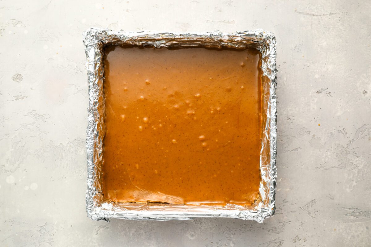 caramel mixture poured over baked crust.