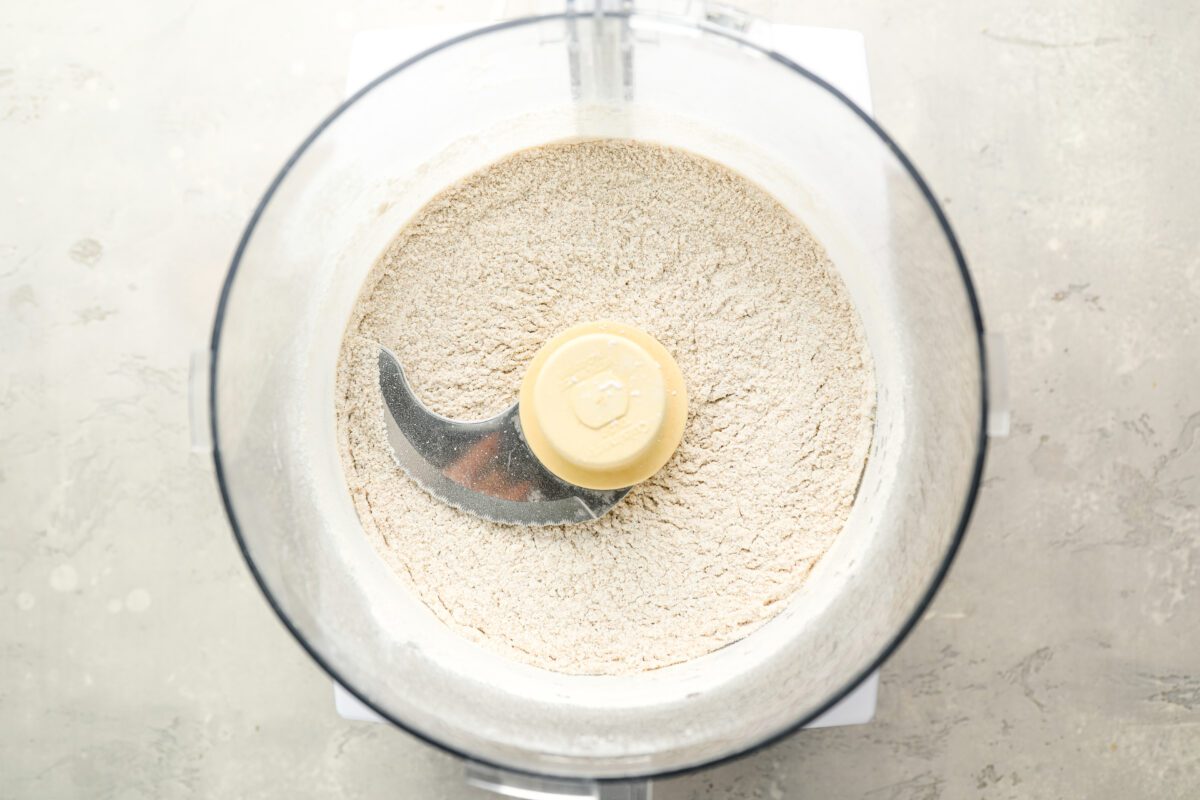 flour, brown sugar, cornstarch, and salt in bowl of food processor.