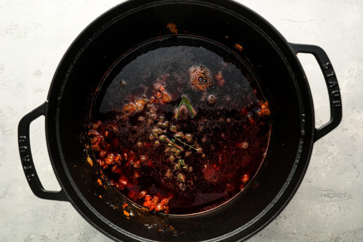 Red wine simmering in Dutch oven.