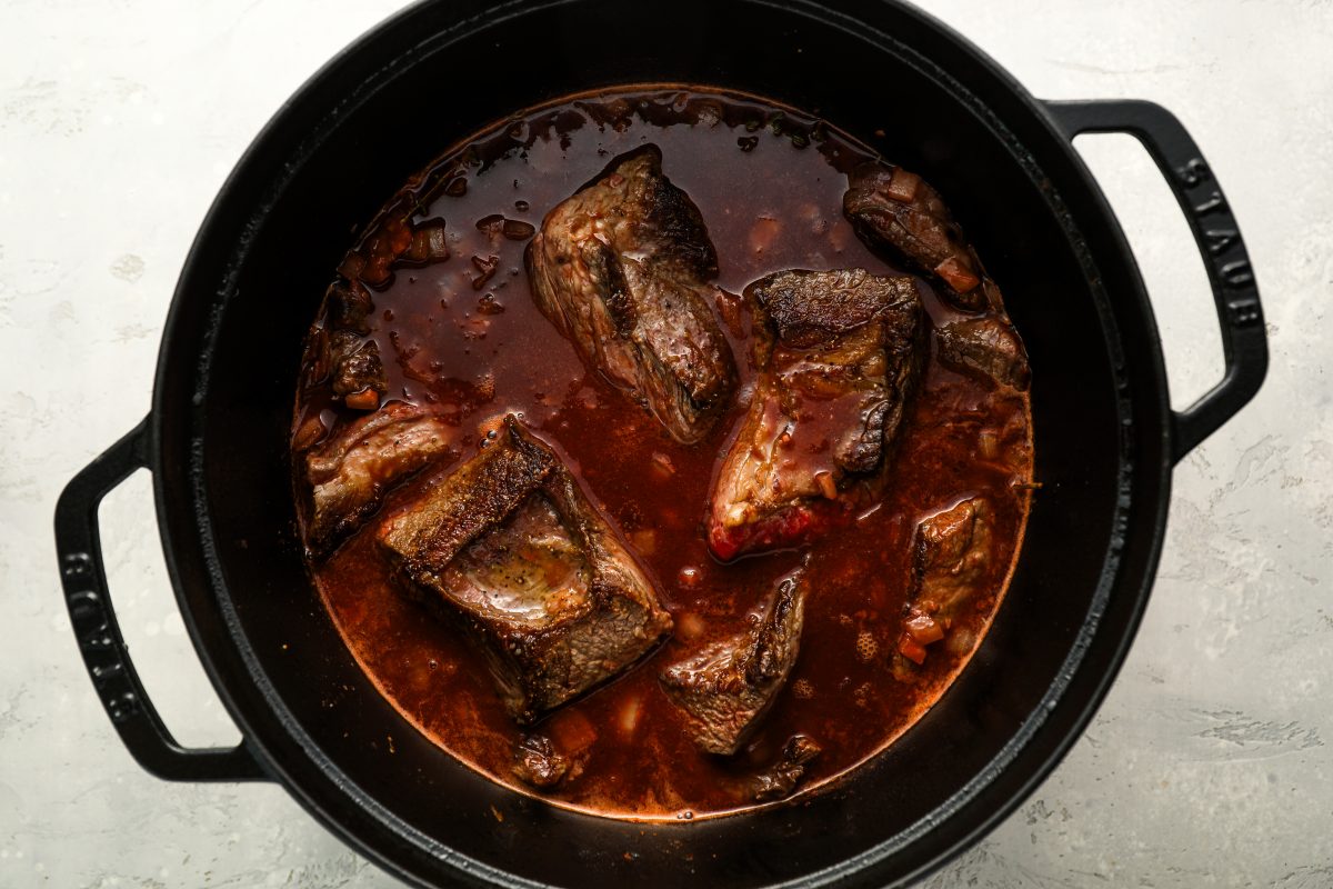 Short ribs and broth added to Dutch oven.