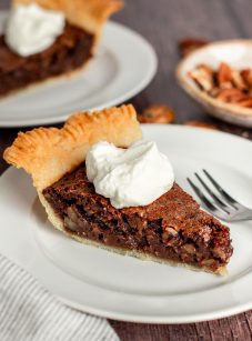 slices of chocolate pecan pie on plates