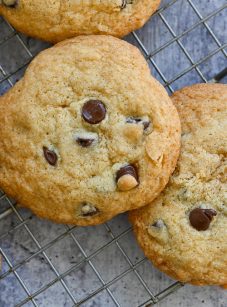 Gluten free chocolate chip cookies cooling on a wire rack.